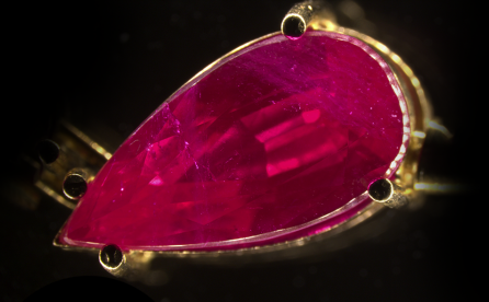 A jewel with a large number of flux-grown synthetic rubies 